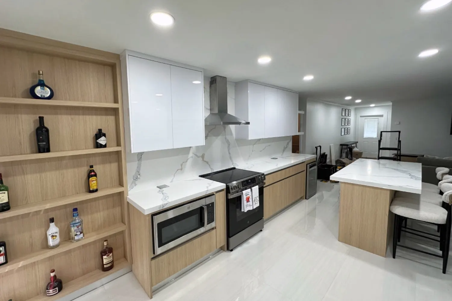 Kitchen 1: light wood shelving, range and hood