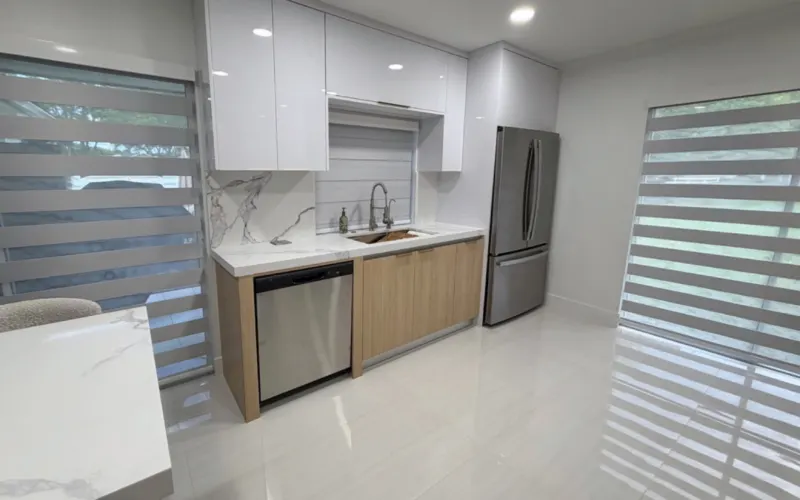 Kitchen 1: sink area with light wood cabinets