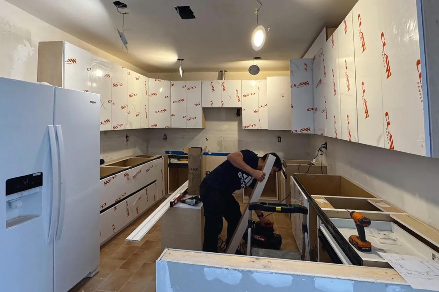During the work: new cabinets installed, still with their protective film